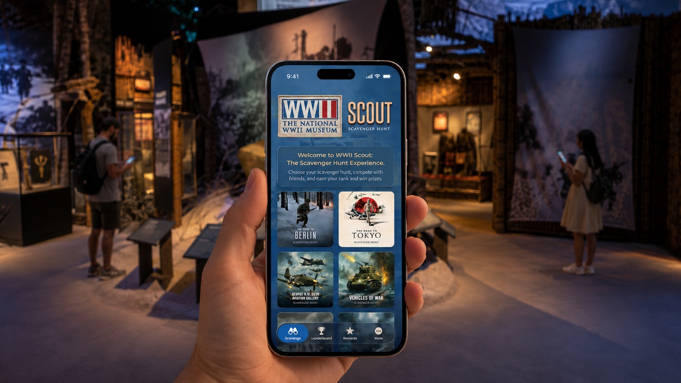 WWII Scout scavenger hunt app on a phone, held inside a National WWII Museum gallery